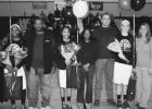 North Forney Lady Falcon basketball seniors and their families honored at their last home game Tuesday night at NFHS—From left to right, the seniors being recognized are Alaundria Norris (#34), Alexandria Webb (#14), and Emily Willey (#11) and their parents.